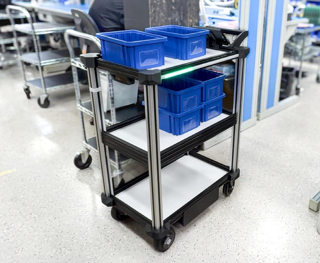 Model C2 carrying bins of components on a production floor
