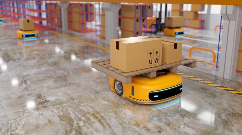 Autonomous Mobile Robot (AMR) delivering boxed material in a warehousing environment