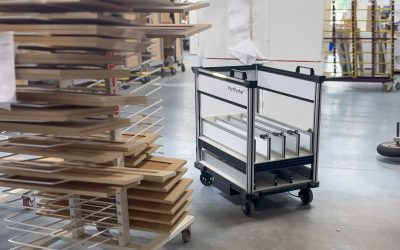 Model C2 PartPorter, an autonomous robotic cart by Quasi Robotics, navigating through a cabinet manufacturing environment