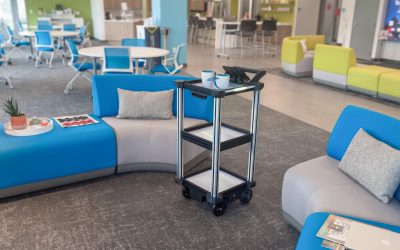 C2 Mini AMR robot delivering refreshments to visitors in an office environment