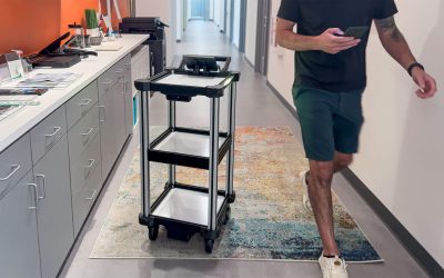 The Quasi C2 Mini AMR Cart in an office hallway environment with foot traffic